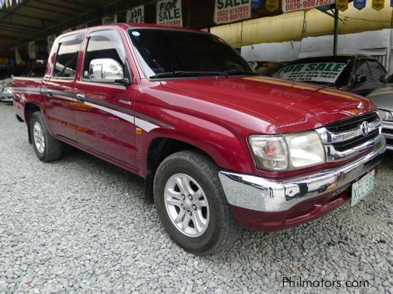 1999 maroon toyota hilux 4x4 pickup